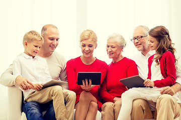 Image showing smiling family with tablet pc computers at home
