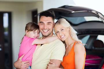 Image showing happy family with hatchback car at home parking