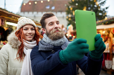 Image showing couple taking selfie with tablet pc in old town