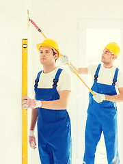 Image showing group of builders with tools indoors