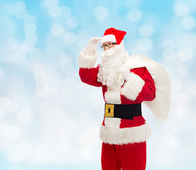 Image showing man in costume of santa claus with bag