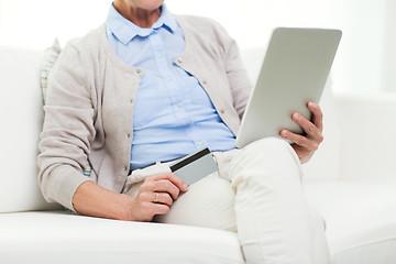 Image showing senior woman with tablet pc and credit card