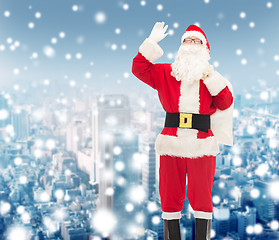 Image showing man in costume of santa claus with bag