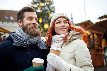 Image showing happy couple drinking coffee on old town street