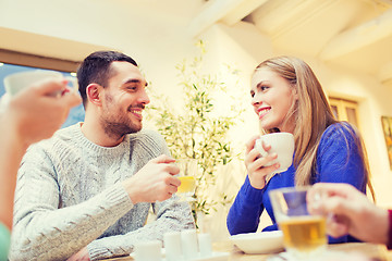 Image showing happy couple meeting and drinking tea or coffee