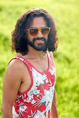 Image showing smiling young hippie man on green field