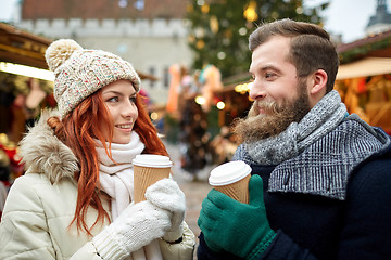 Image showing happy couple drinking coffee on old town street