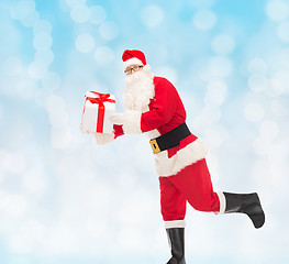 Image showing man in costume of santa claus with gift box