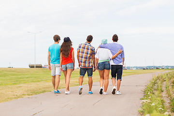 Image showing close up of teenage friends walking outdoors