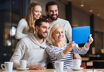 Image showing happy friends with tablet pc taking selfie at cafe