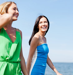 Image showing girls walking on the beach