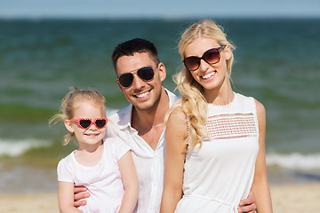 Image showing happy family in sunglasses on summer beach