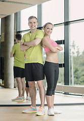 Image showing smiling man and woman in gym