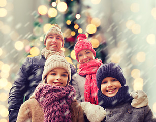 Image showing happy family in winter clothes outdoors