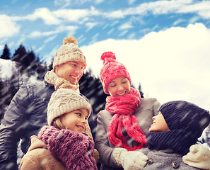 Image showing happy family in winter clothes outdoors