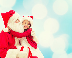 Image showing smiling little girl with santa claus