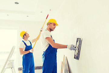 Image showing group of builders with tools indoors