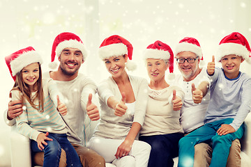 Image showing happy family sitting on couch at home