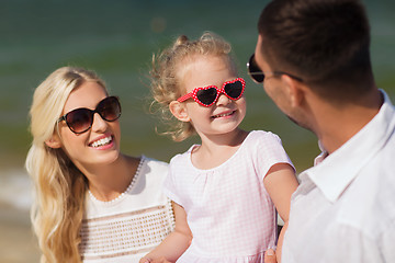 Image showing happy family in sunglasses on summer beach