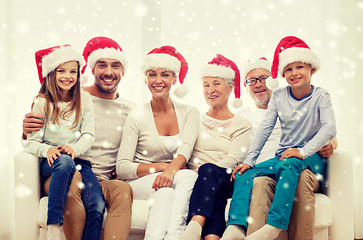 Image showing happy family sitting on couch at home