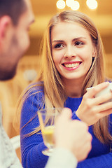 Image showing happy couple dating and drinking tea at cafe