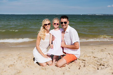 Image showing happy family in sunglasses on summer beach