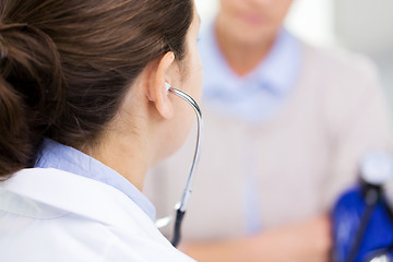 Image showing doctor with tonometer and senior woman at hospital