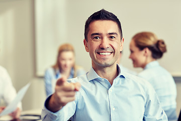 Image showing group of smiling businesspeople meeting in office