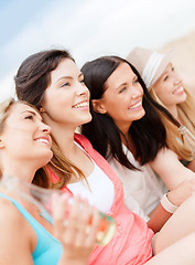 Image showing girls with drinks on the beach