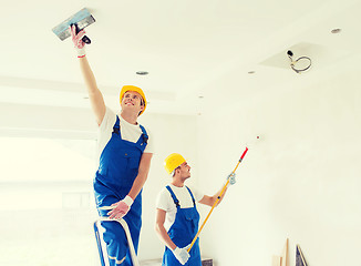 Image showing group of builders with tools indoors