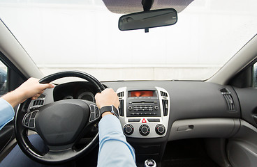 Image showing close up of young man driving car