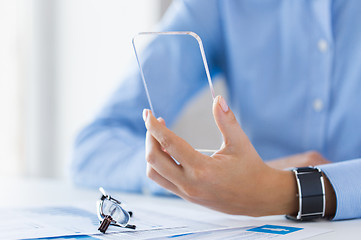 Image showing close up of woman with transparent smartphone