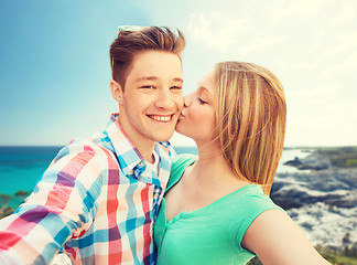 Image showing happy couple taking selfie on summer beach