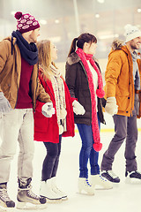 Image showing happy friends on skating rink