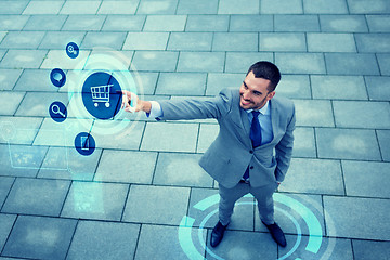 Image showing young smiling businessman outdoors from top