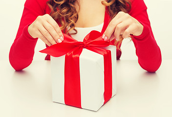 Image showing woman hands opening gift boxes