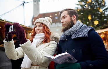 Image showing couple taking selfie with smartphone in old town