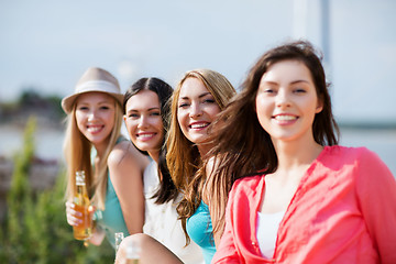 Image showing girls with drinks on the beach