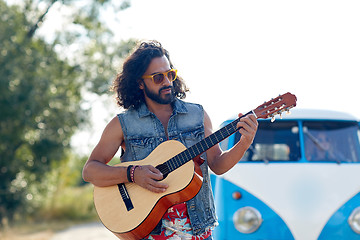 Image showing hippie man playing guitar over minivan car outdoor