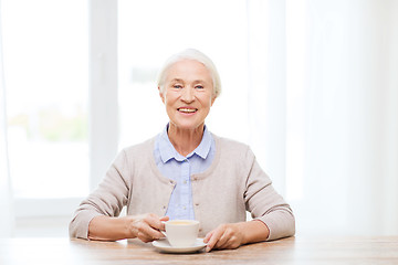 Image showing happy senior woman with cup of coffee