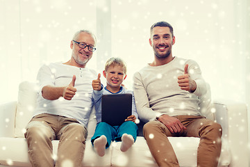 Image showing smiling family with tablet pc at home