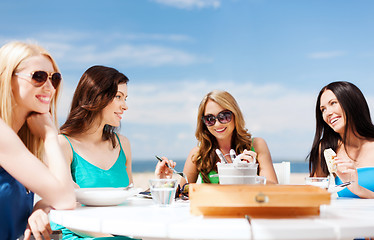 Image showing girls in cafe on the beach