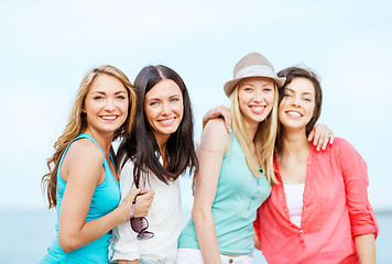 Image showing group of girls chilling on the beach