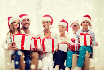 Image showing happy family sitting on couch at home