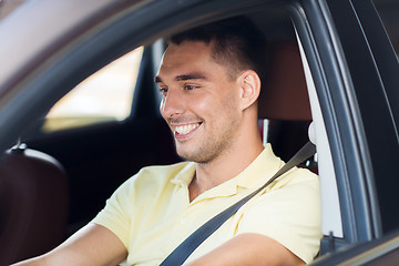 Image showing happy smiling man driving car outdoors