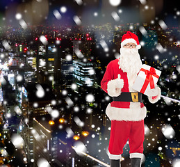 Image showing man in costume of santa claus with gift box