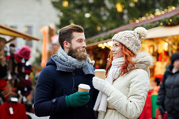 Image showing happy couple drinking coffee on old town street