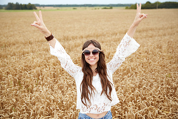 Image showing smiling young hippie woman on cereal field