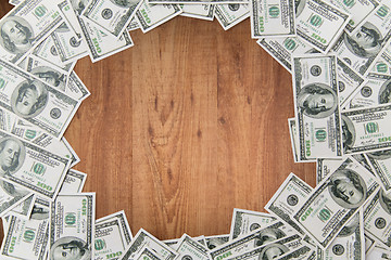 Image showing close up of dollar money on wooden table