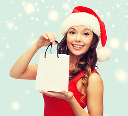 Image showing woman in red dress with shopping bag